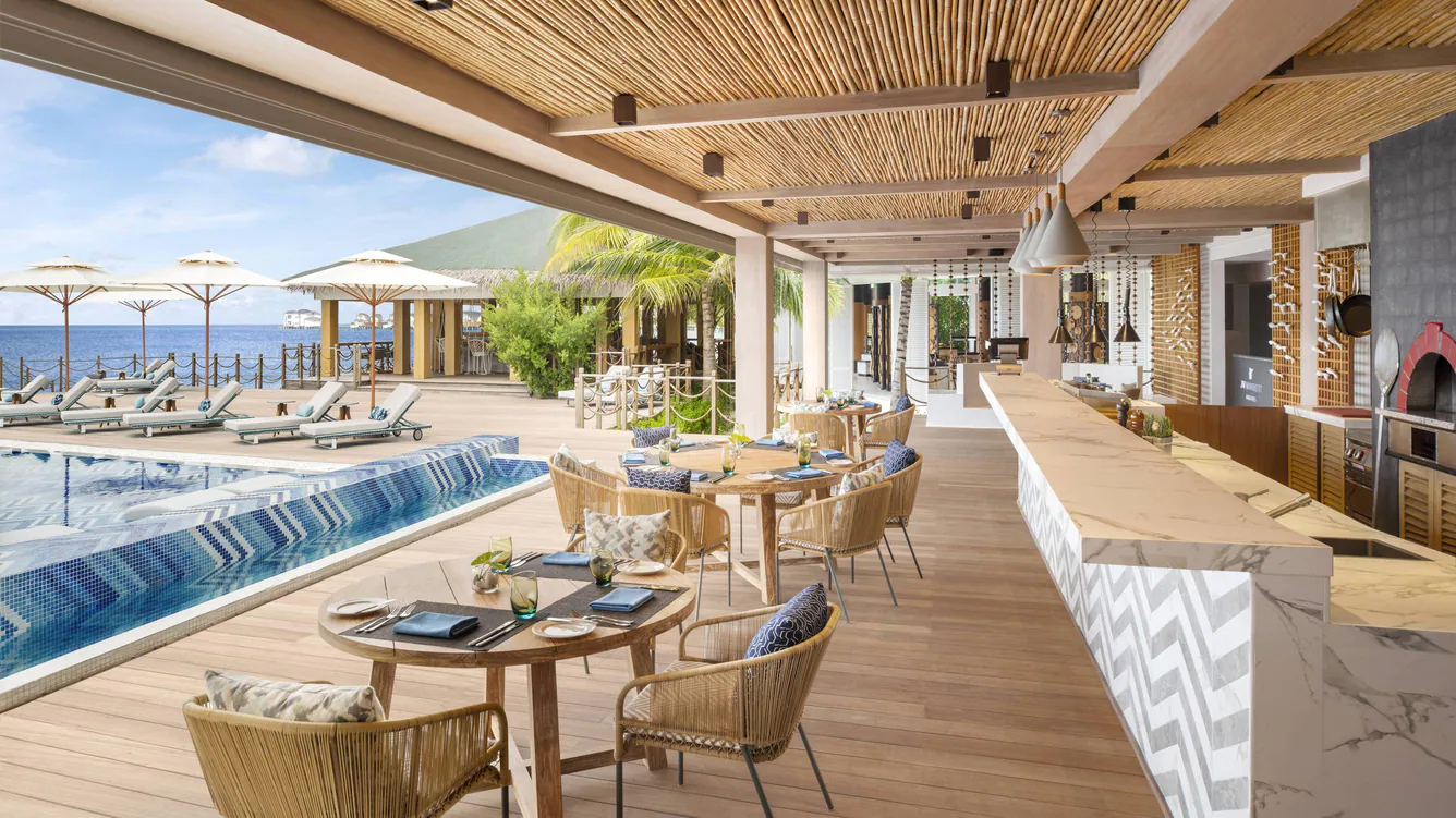 Custom hospitality furniture at a resort poolside restaurant