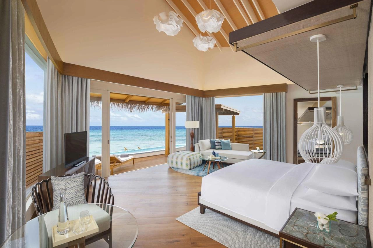 Contemporary oceanfront hotel suite furnished with custom furniture